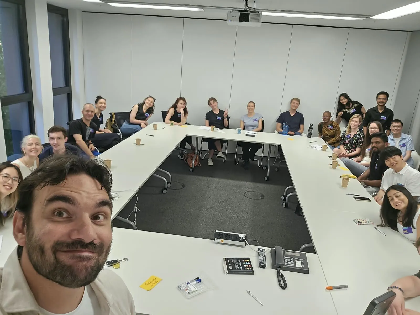 A room of around twenty scientists seated around a large table during a workshop at the Merck Innovation Cup 2026.